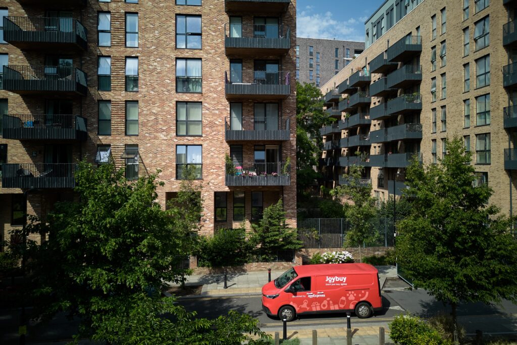 Joybuy JoyExpress van navigating a residential neighborhood