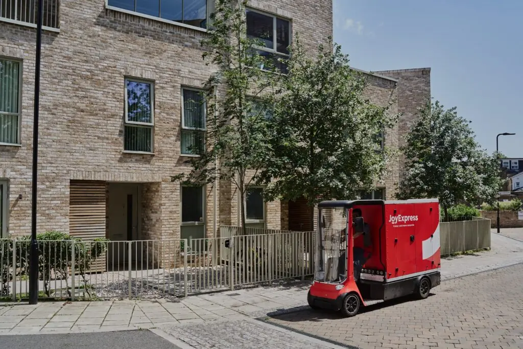 Joybuy JoyExpress electric cargo bike on residential pathway
