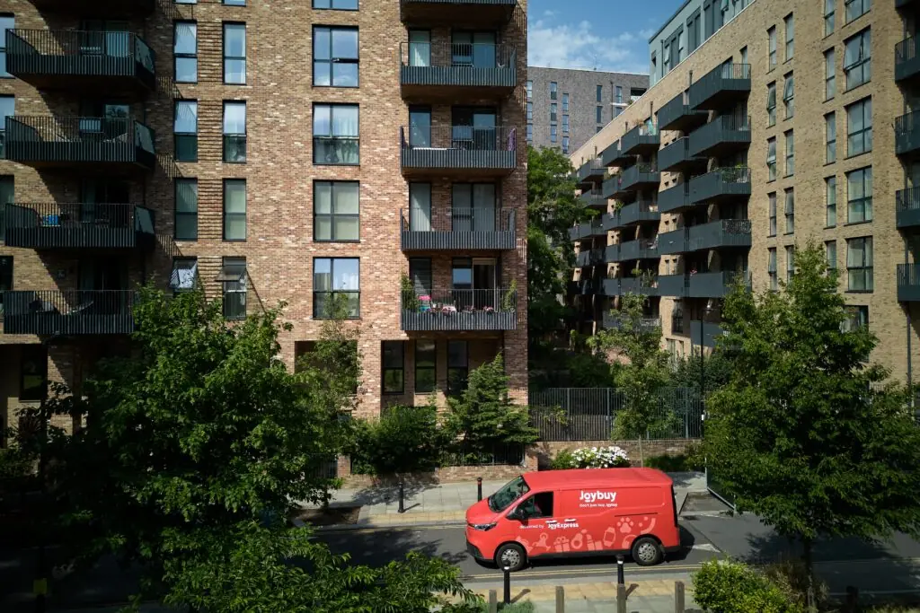 Joybuy JoyExpress van navigating a residential neighborhood